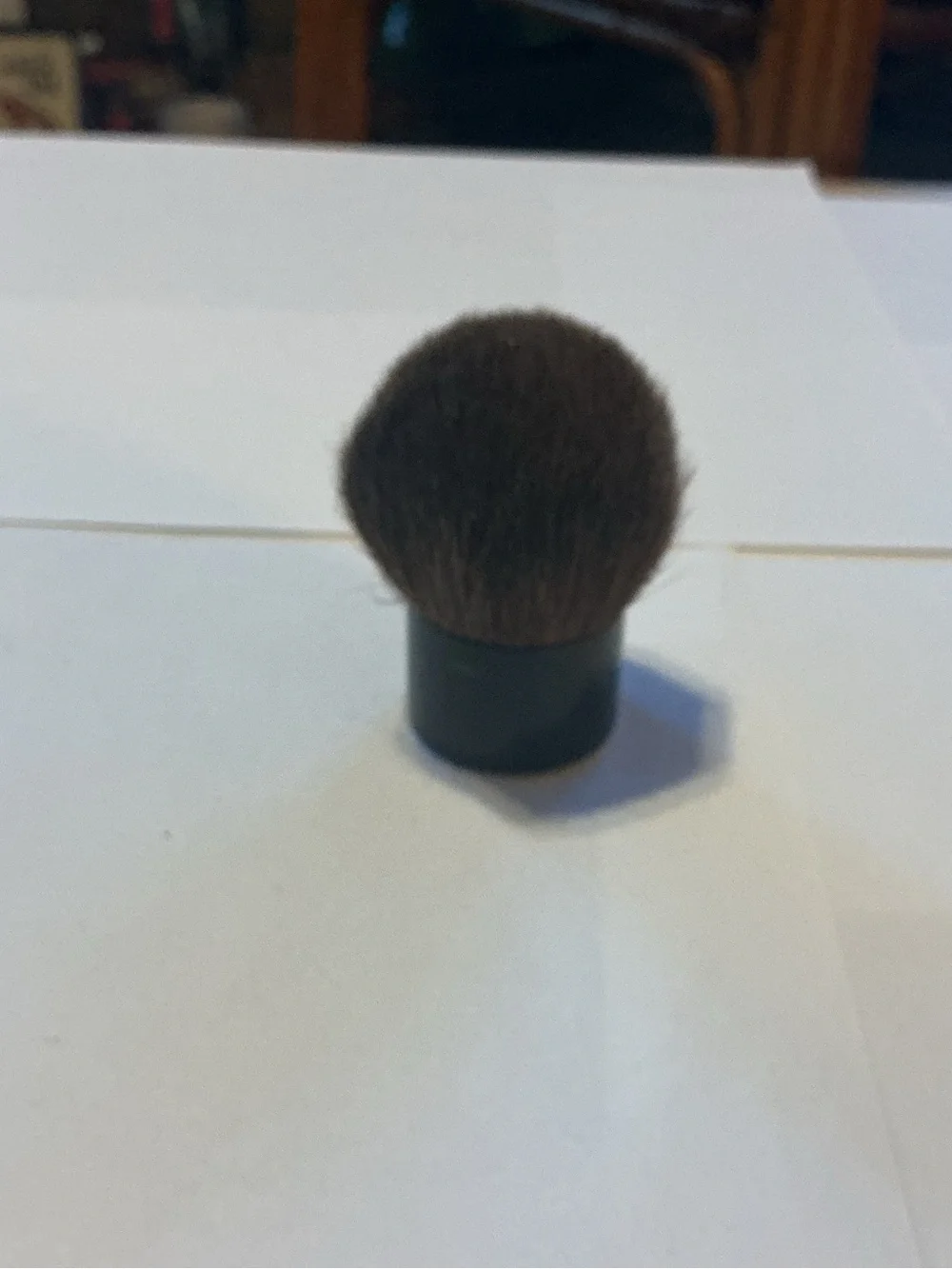 Chanel Kabuki Brush, 2” high by 1.5” wide